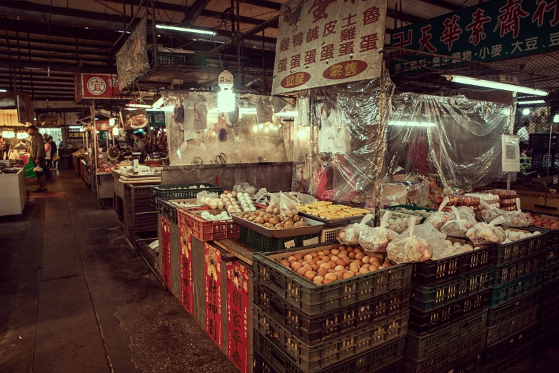 a marketplace with many types of fruit on display