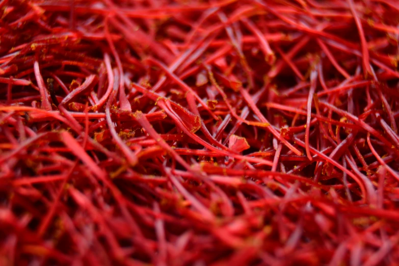 a close up po of red yarn