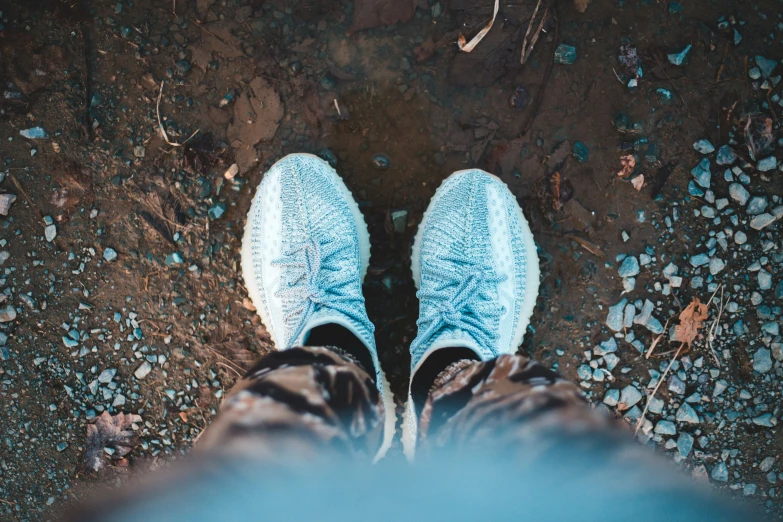 a person standing on top of a dirt field