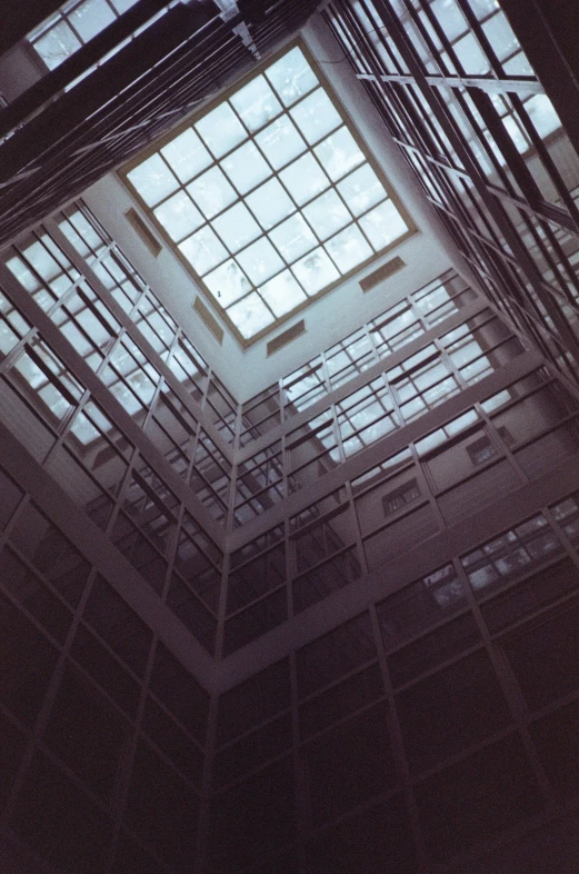 the ceiling is covered in glass panels, and there are several windows that have been placed above