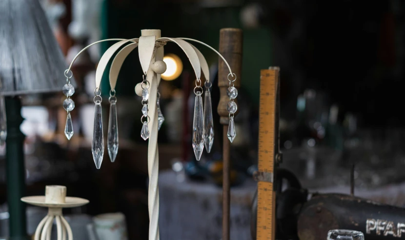 a table with a lamp and glass items in it