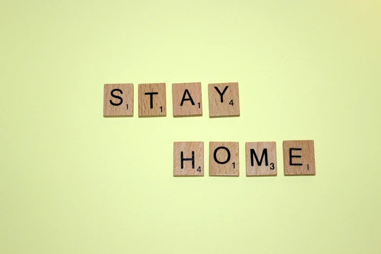 words spelled out on wooden blocks spelling stay home