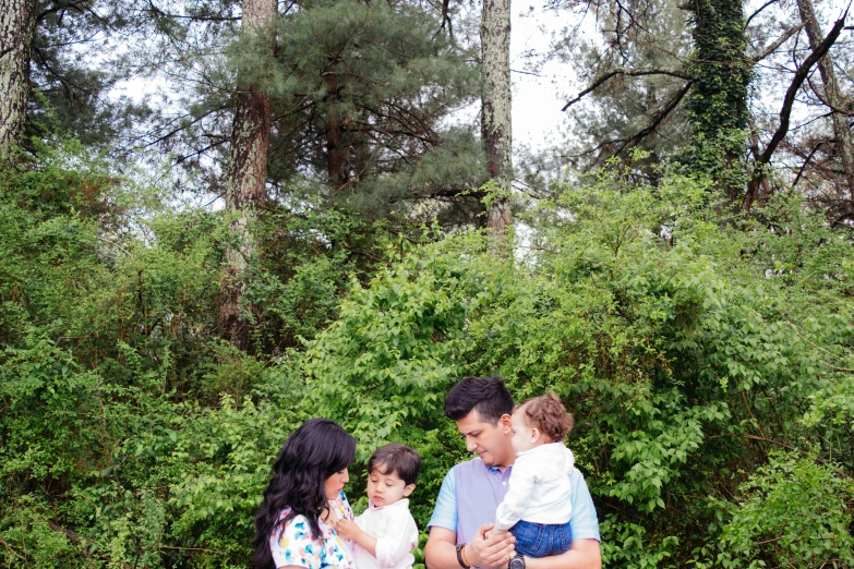 a family of three posing for the camera