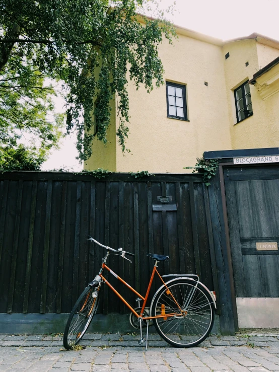 there is a bike parked in front of the building