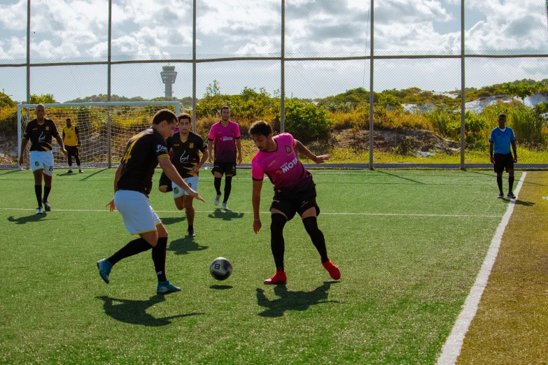 a group of young people playing a game of soccer