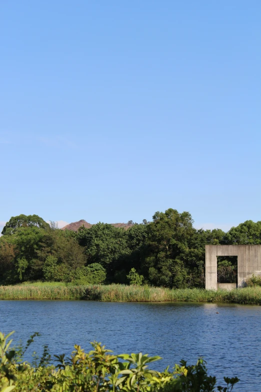 a po of a boat in the water next to a bridge