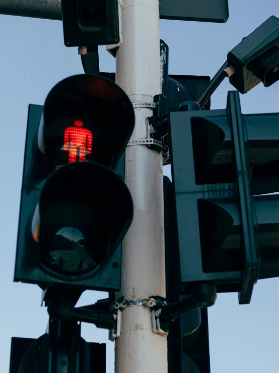 stoplight at an intersection with traffic signals pointing in opposite directions