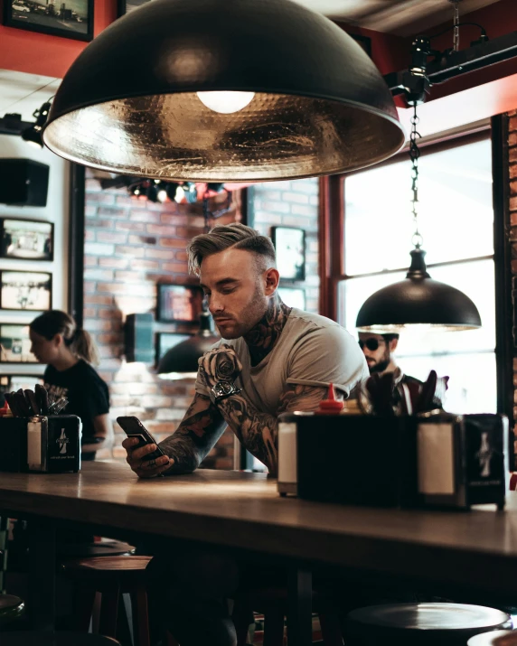 a man that is sitting at a table