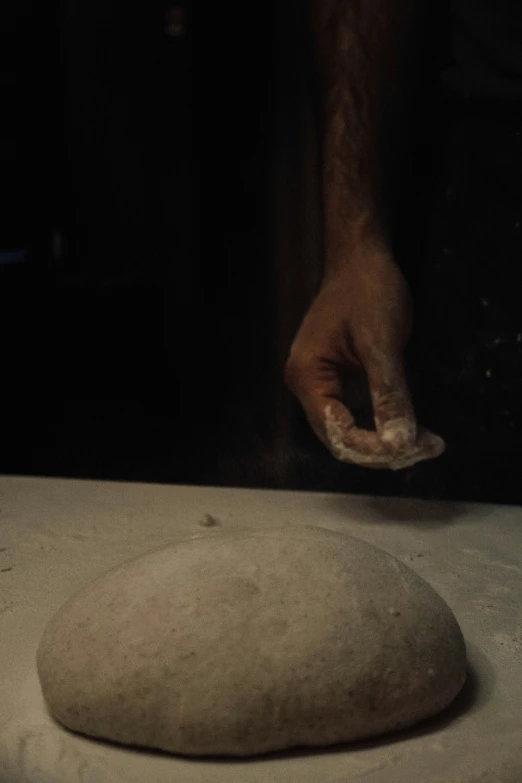 a person putting soing on a stone