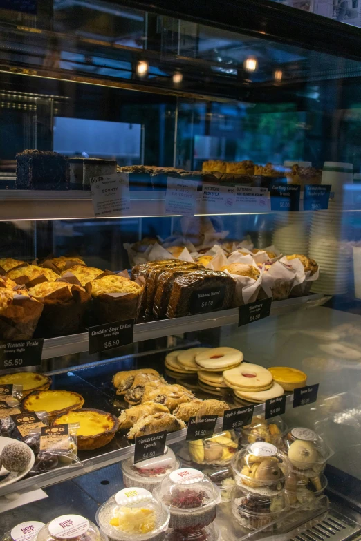 this display case features pastries and donuts