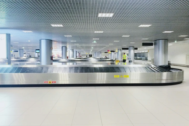 baggage claim belt in a large empty airport