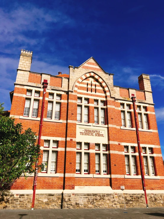 the old building is red brick and has many windows