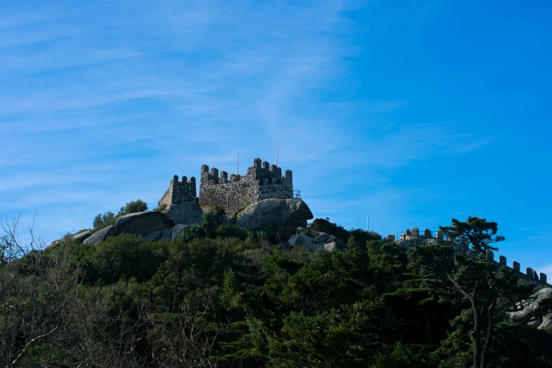 a castle that is standing on top of a hill