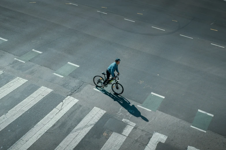 a person riding a bicycle on a city street