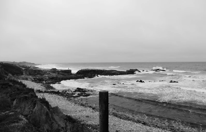 an old po of the ocean and sand beach