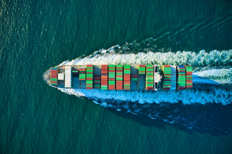 an aerial view of a ship in the ocean