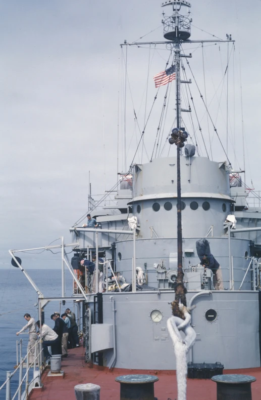 a person standing on the deck of a large ship