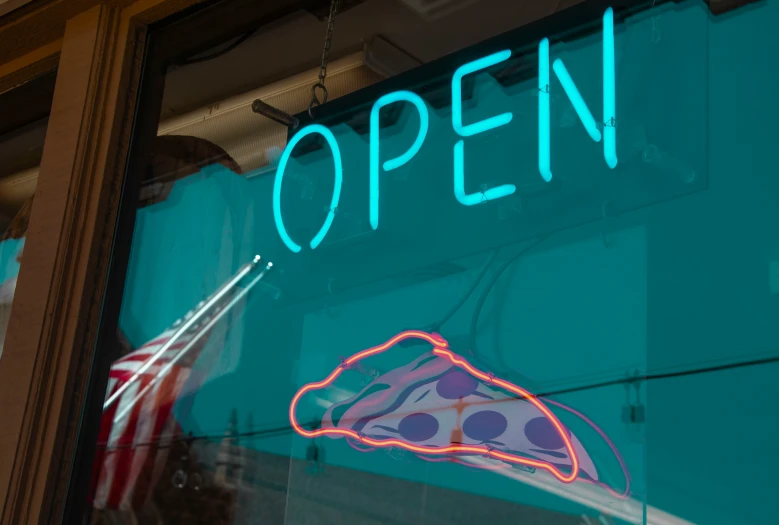 a neon sign and window for a restaurant