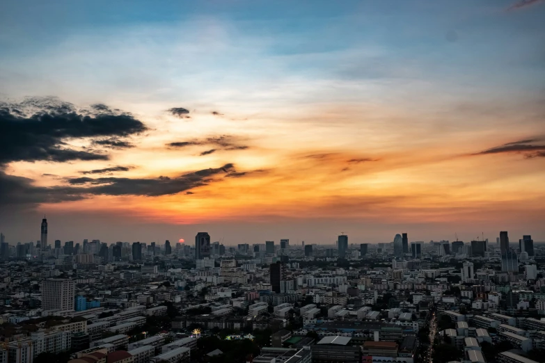 the clouds above the city in the evening