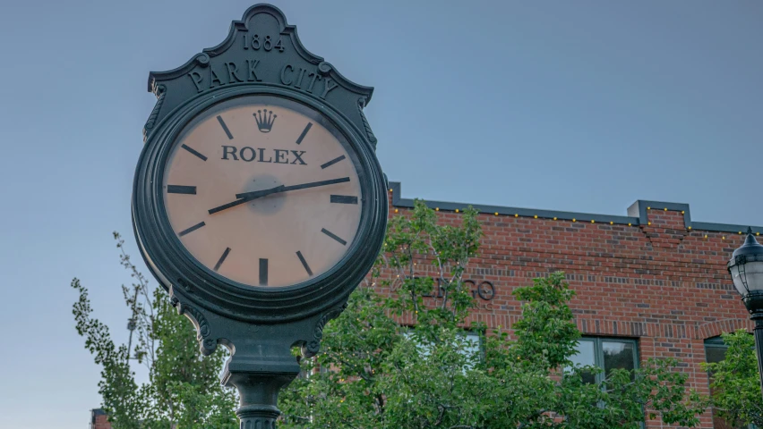 an ornate clock in the middle of a large park