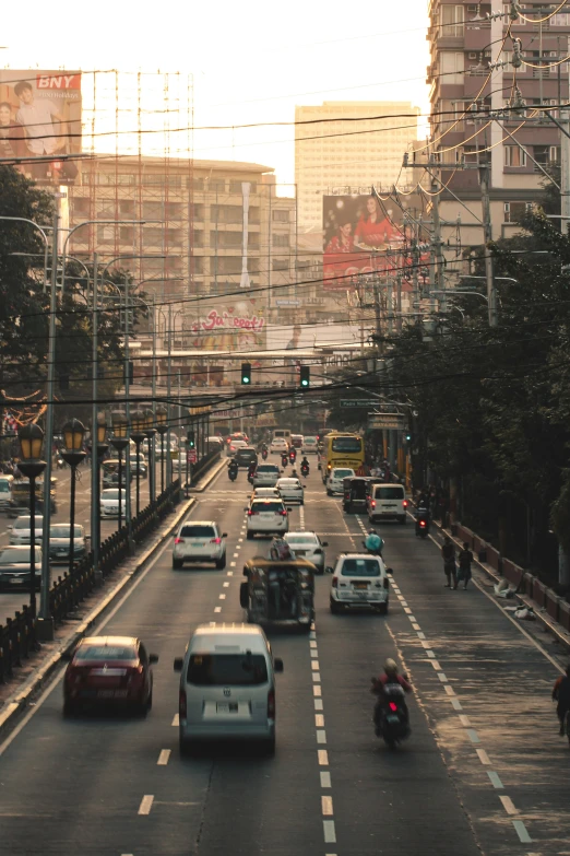 cars driving on the road in front of a bus