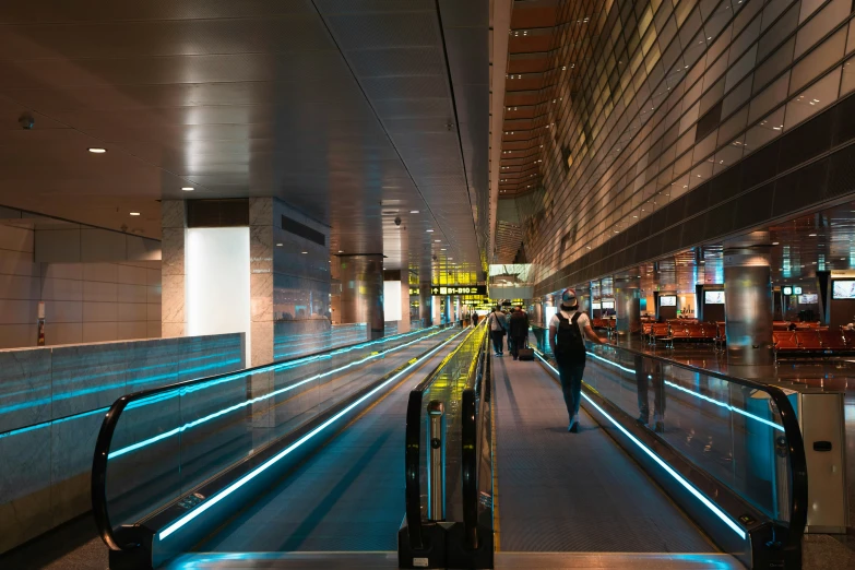 an airport has several rows of baggage conveyor beltes