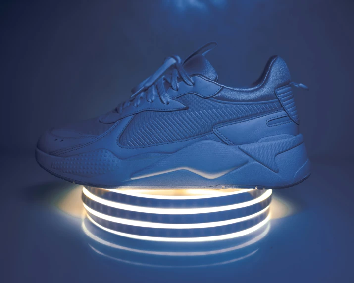 a sneaker lit up with a shoe lace, lights and tape