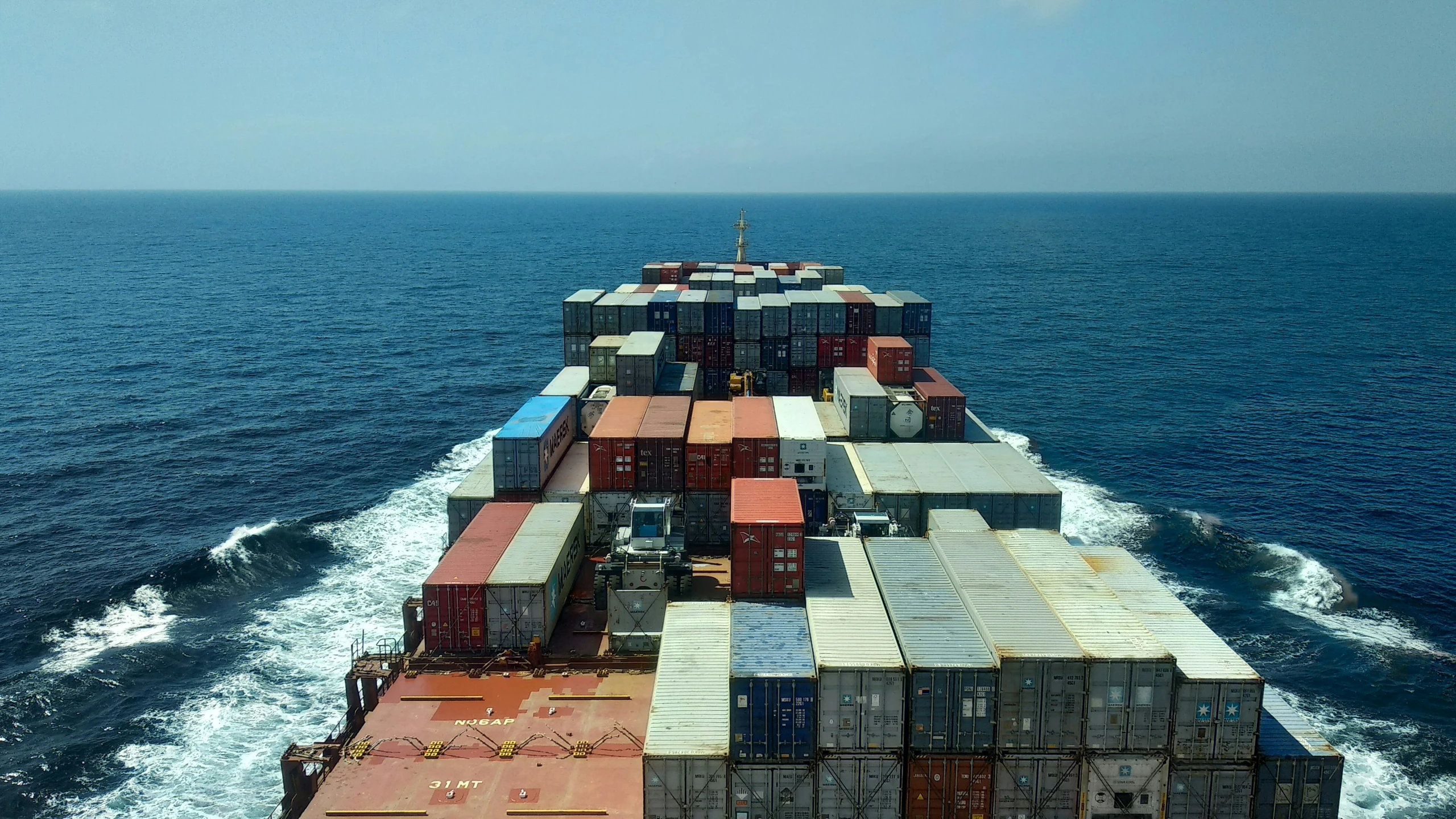 large container ship sailing in open body of water