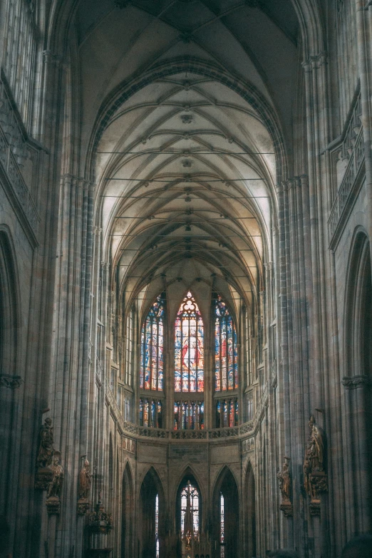 the large cathedral has many windows and statues