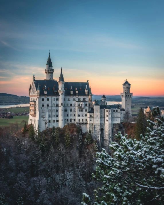 a big castle with towers that look like they're in the middle of winter