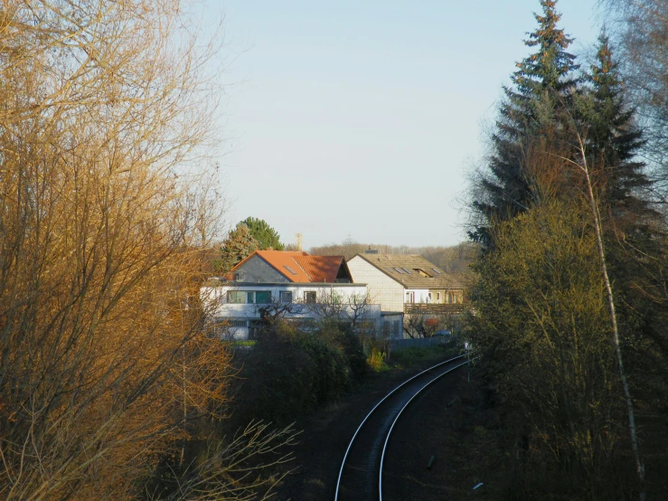 a house with a fence and some trees