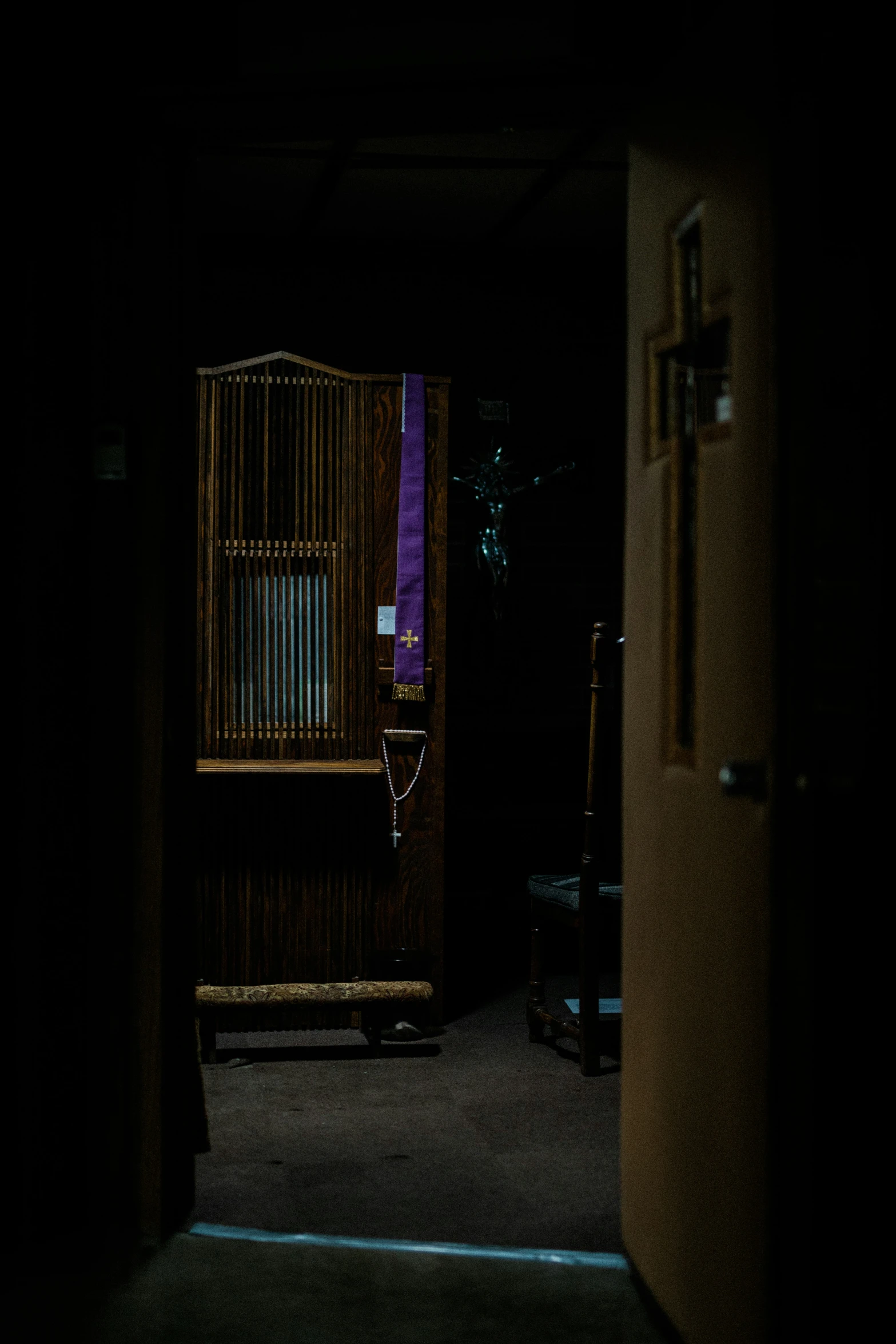 the door is dark in this very dimly lit room