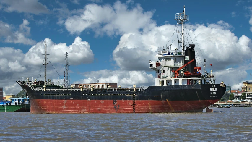 a cargo ship floating in a body of water