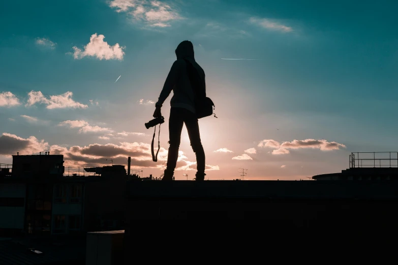 a person standing on top of a building