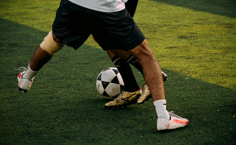 a soccer player about to kick a soccer ball