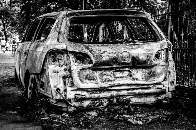 this is an old, dirty car parked in the dirt