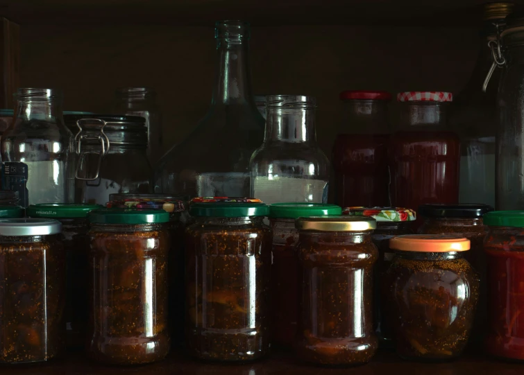 several jars with different types of food on a table