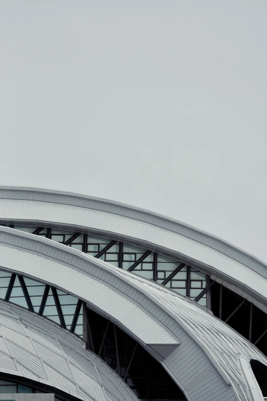 an airplane is flying in the air at an airport