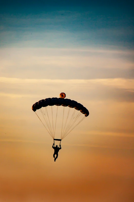 person being lifted by para sail in the sky