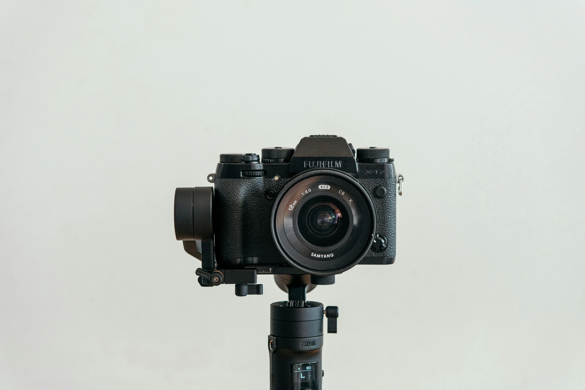 a camera is displayed with a white backdrop