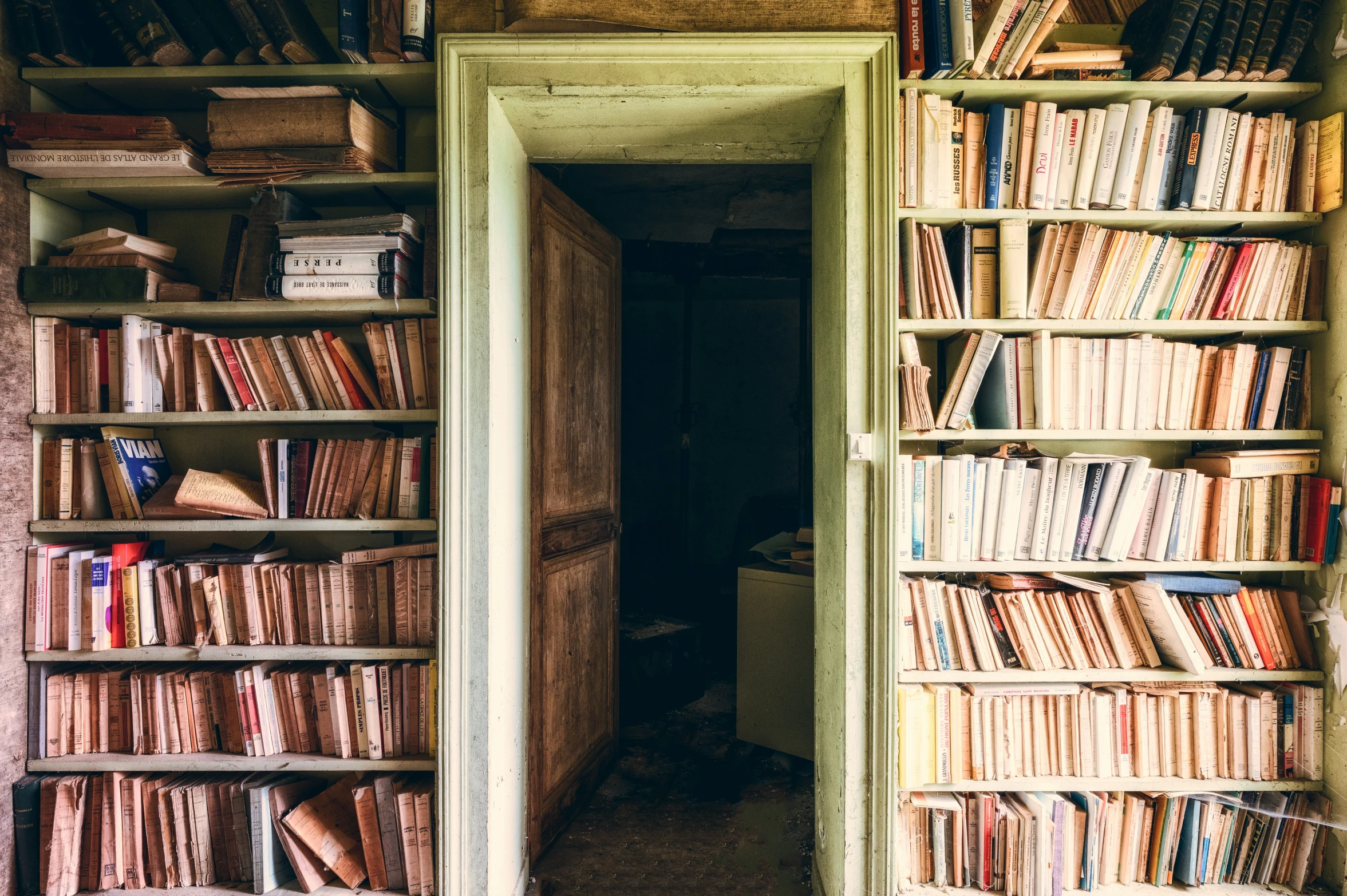 a bookshelf filled with different kinds of books