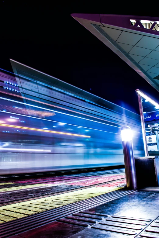 train lights streaking in the dark with long exposure