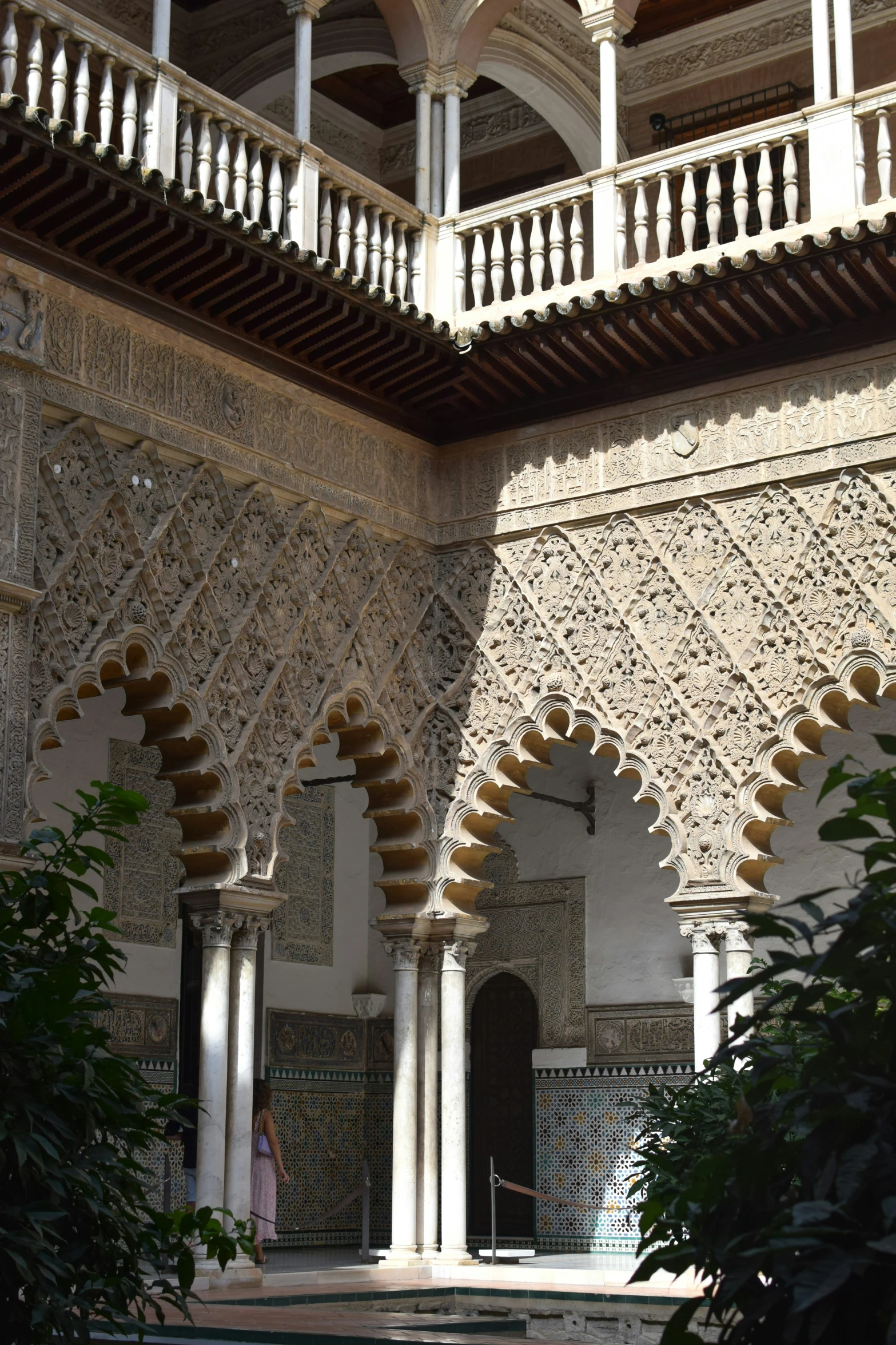 an ornate building has arches and pillars