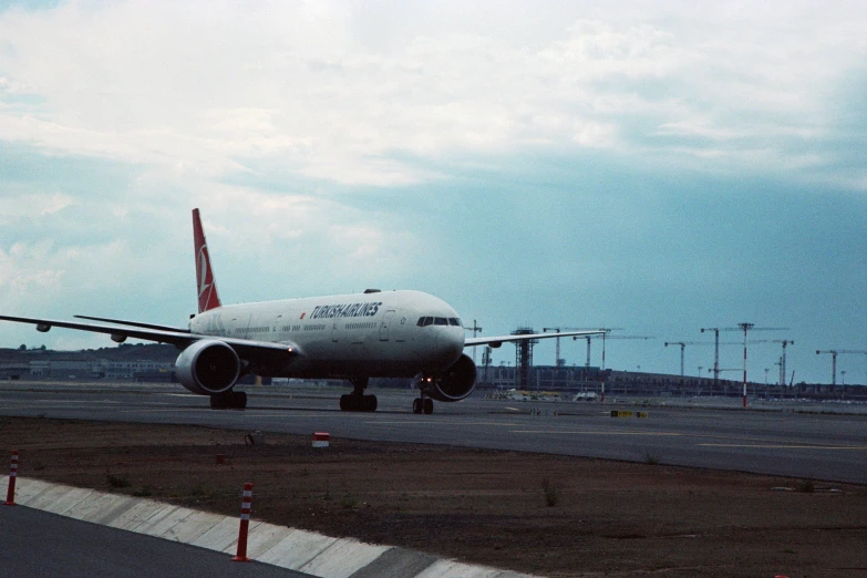 large jetliner sitting on top of an airport runway
