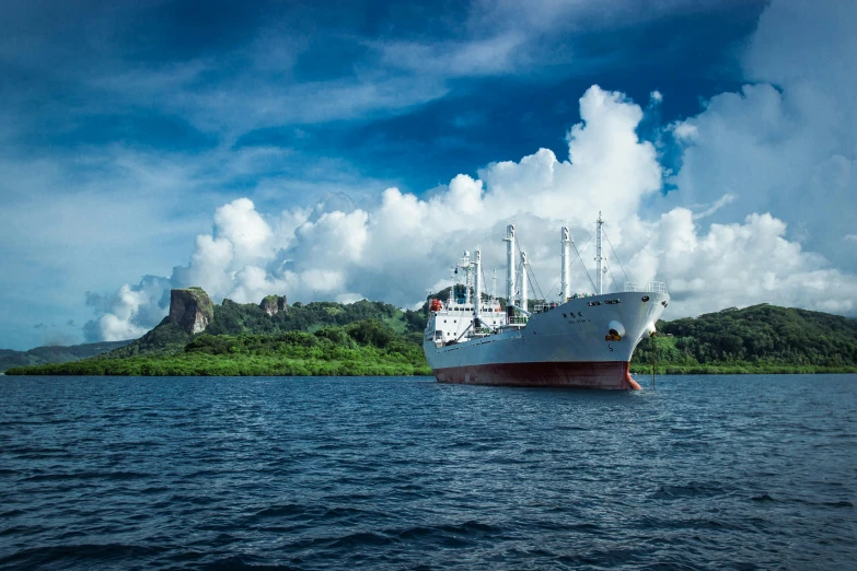 a large ship sitting in the middle of the ocean