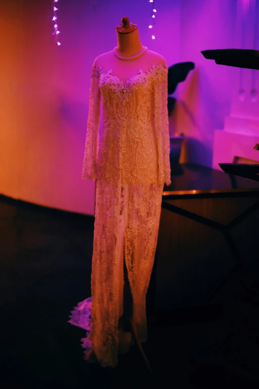 a dress on display with a mannequin at a museum