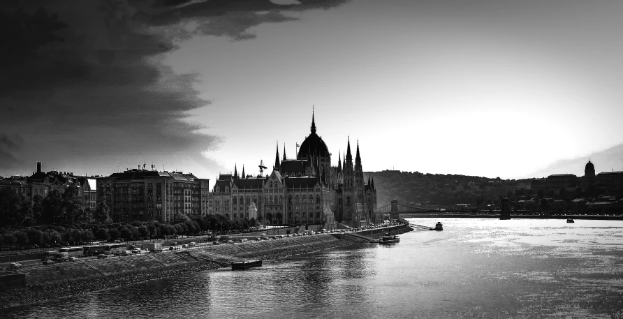 a black and white po of buildings near a body of water