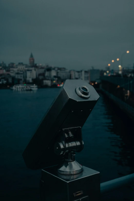 a camera is shown on a tripod looking out over a city
