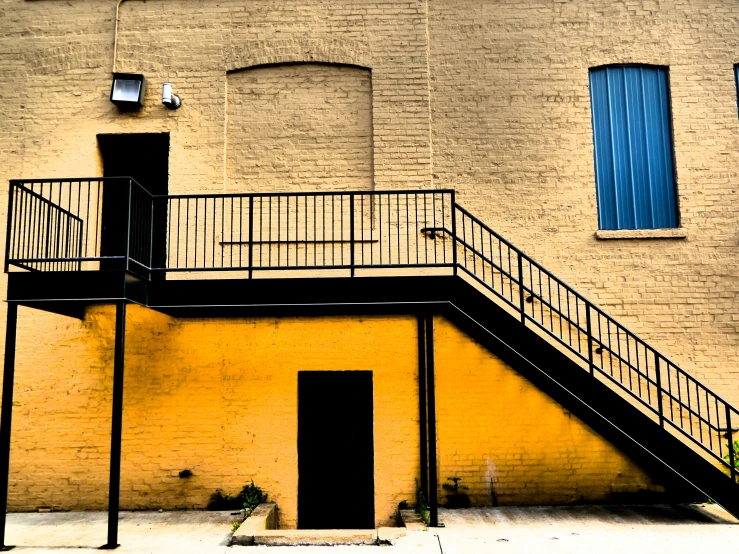 the bottom of a staircase leading to an apartment