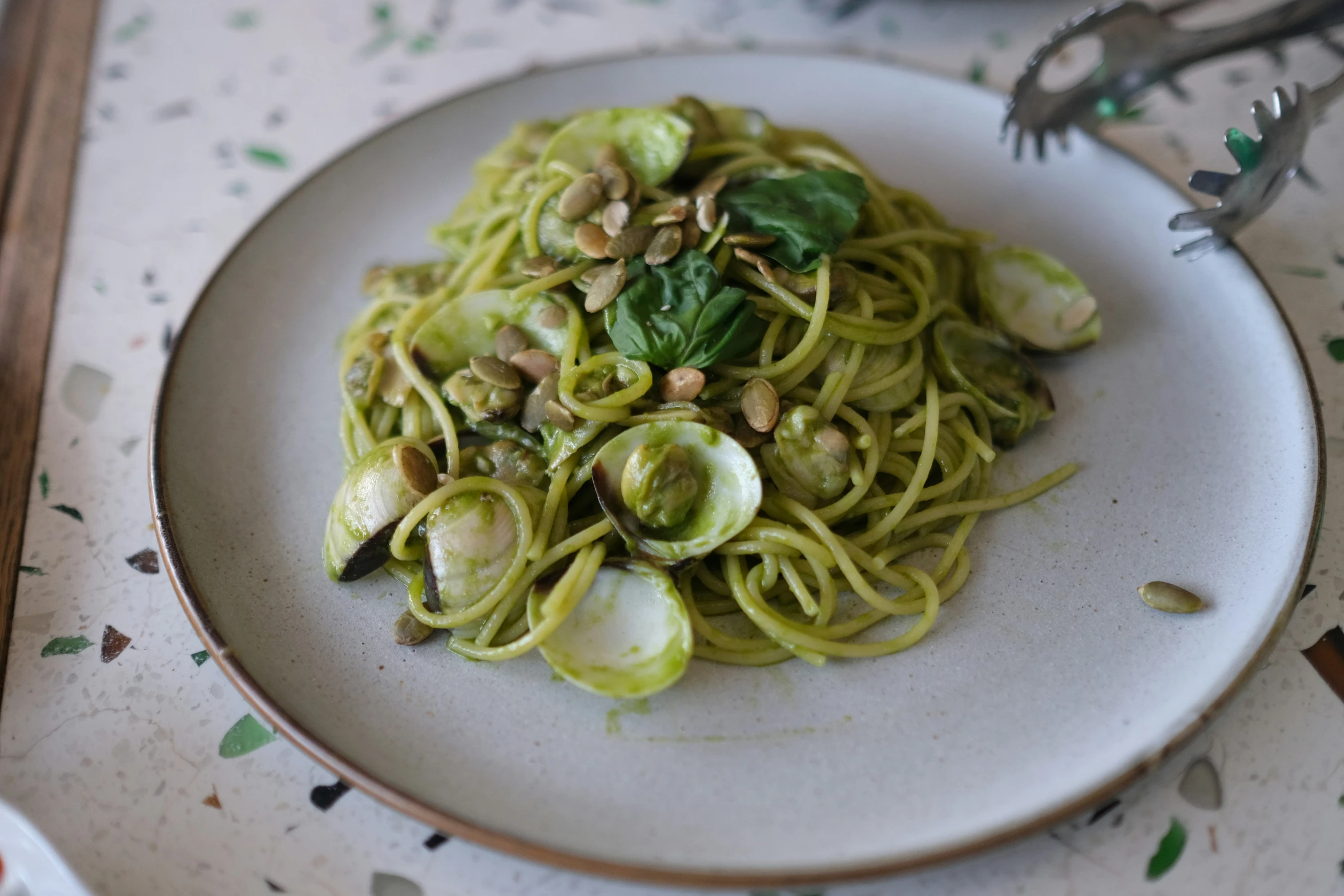 this is a dish with pasta, squash and mushrooms on top